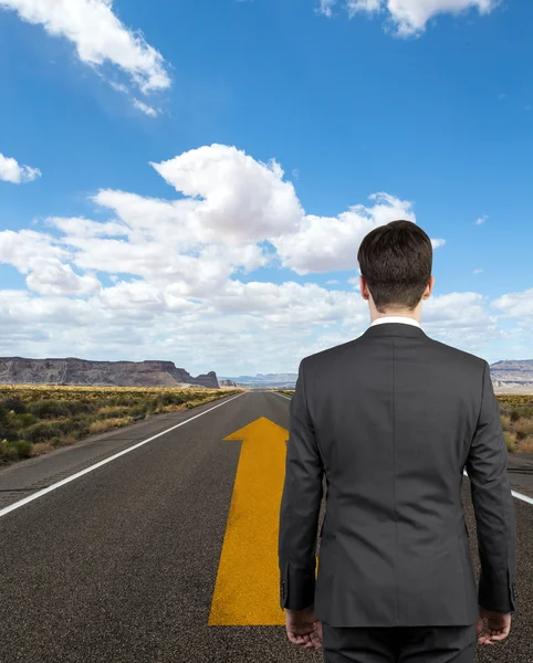 Businessman on road — Stock Photo, Image