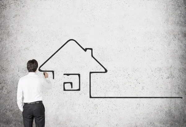 Homem de negócios desenho casa — Fotografia de Stock