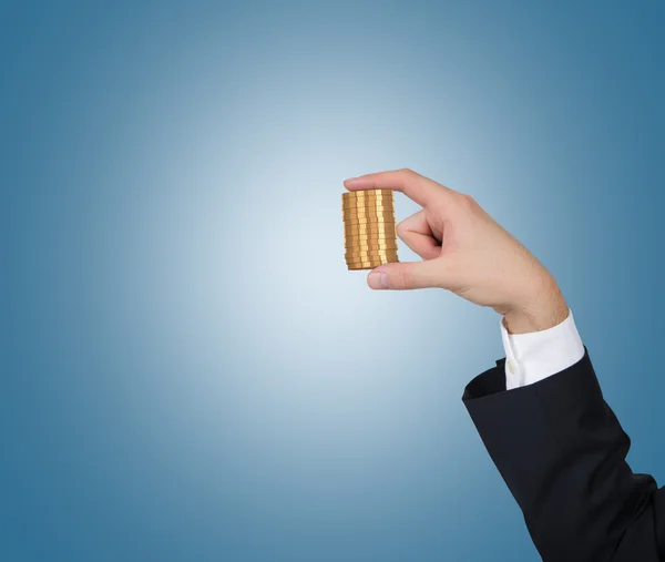 Hand puts coins — Stock Photo, Image