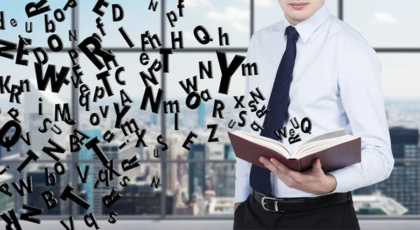 businessman holding book