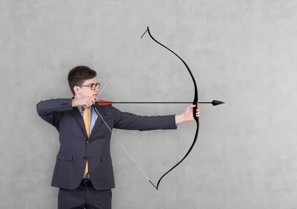 Businessman holding a bow — Stock Photo, Image