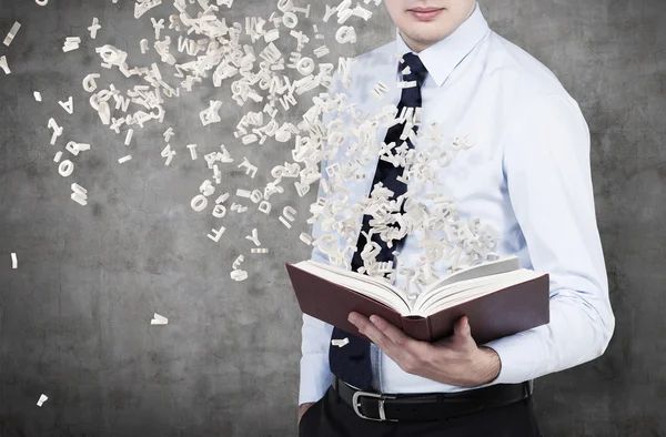 Businessman holding book — Stock Photo, Image