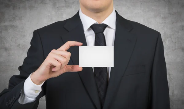 Businessman handing a business card — Stok fotoğraf