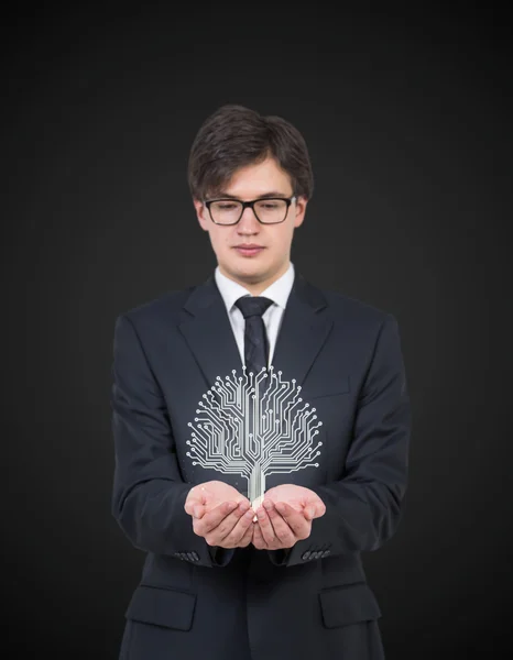 Businessman holding digital tree — Stock Photo, Image