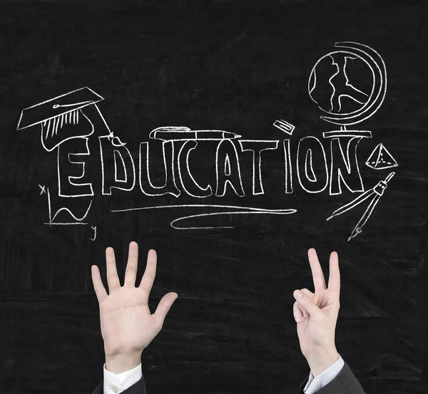 Education symbols on blackboard — Stock Photo, Image