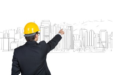 gökdelen işaret eden işadamı