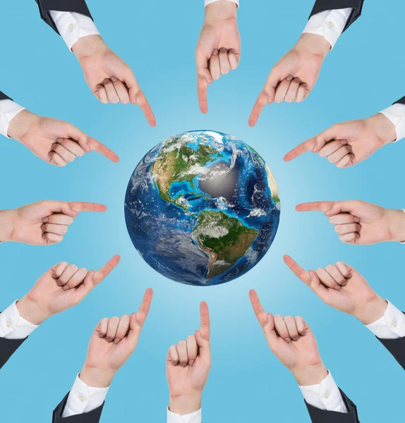 Hands pushing at earth — Stock Photo, Image