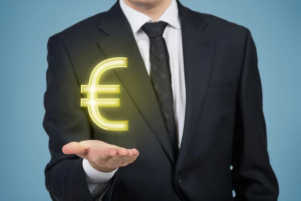 Affärsman anläggning dollar — Stockfoto