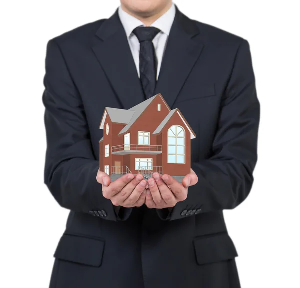 Businessman holding house — Stock Photo, Image