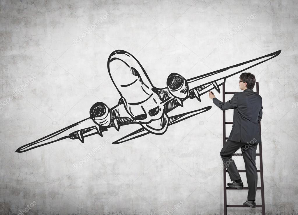 businessman drawing airplane