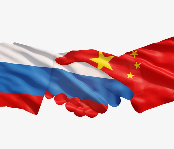 Κινέζικα μια ρωσική σημαίες με μια χειραψία — Φωτογραφία Αρχείου