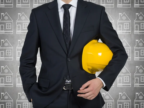 Homem de negócios com capacete amarelo — Fotografia de Stock