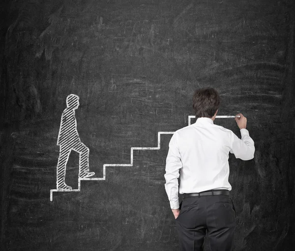 Businessman drawing stairs — Stock Photo, Image