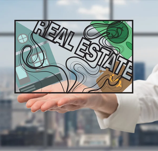 Hand holding real estate symbol — Stock Photo, Image