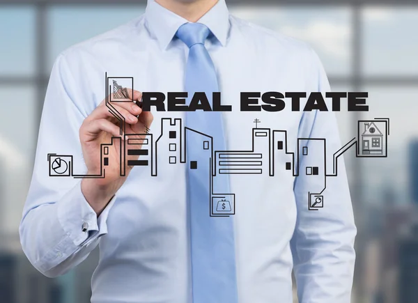 Businessman drawing real estate — Stock Photo, Image