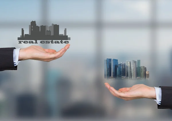 Two hands holding real estate — Stock Photo, Image