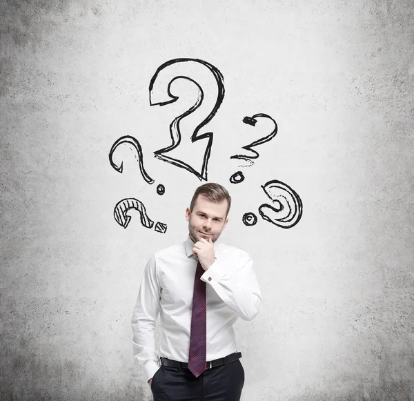 Young businessman is thinking about complicated questions. — Stock Photo, Image