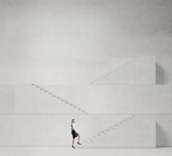 Young woman is going up to the career ladder — Stock Photo, Image