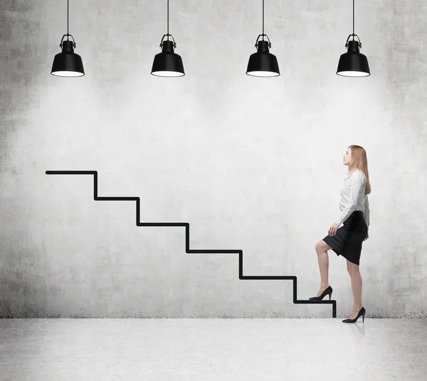 Young woman is going up to the career ladder — Stock Photo, Image