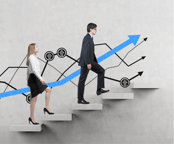A couple is going up. A concept of the successful business team is making efforts at the career stairs.