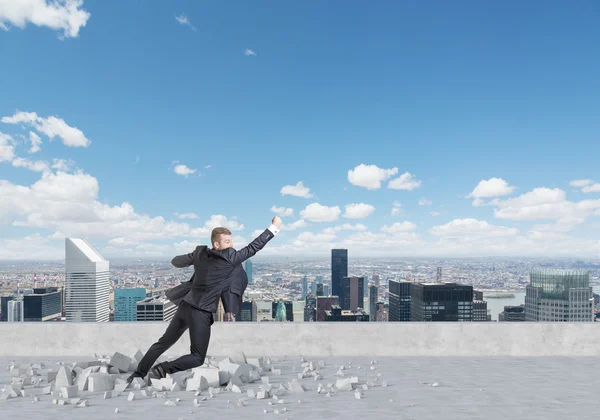 Businessman is flying up from the roof in New York. A concept of the success in career. — Stock Photo, Image