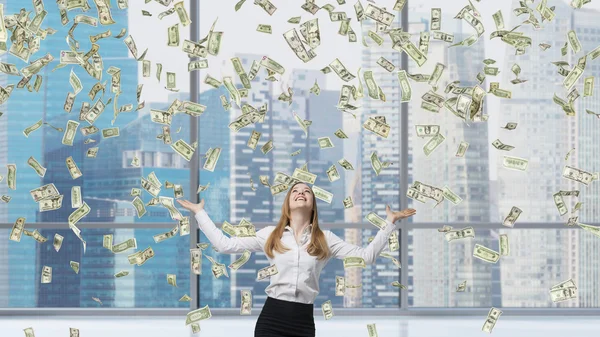 Business woman among flying dollars — Stock Photo, Image