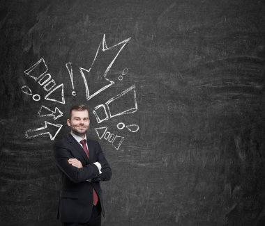 Confident handsome businessman surrounded by drawn arrows pointing to him.