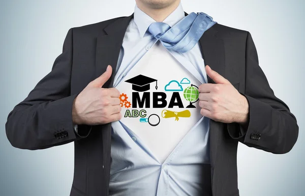 Successful young student is tearing the shirt. Business education icons are drawn on the chest. A concept of the MBA degree. — Stock Photo, Image