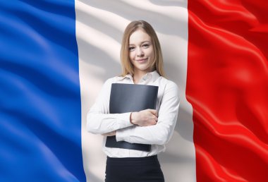 Smiling business lady in a white shirt with a black folder. French flag as a background. clipart