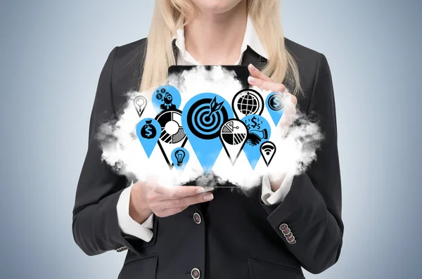Business woman is holding a cloud with business icons as a concept of successful business management. — Stock Photo, Image
