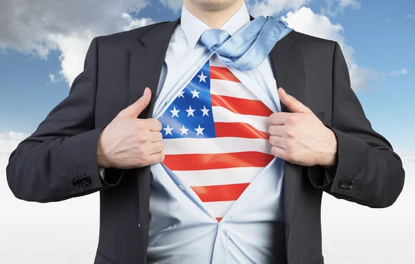 A man tearing the shirt. US flag on the chest. Cloudy sky background. — Stock Photo, Image