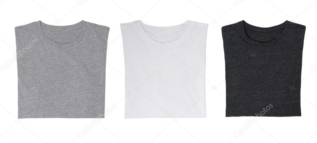 Close-up of the three t-shirts (black, white and grey). Isolated.