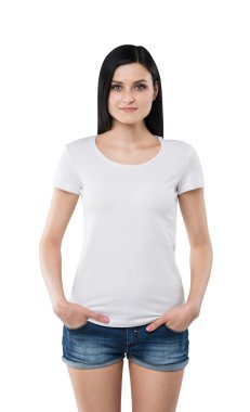 Brunette girl in a white t-shirt and denim shorts. Isolated on white.