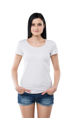 Brunette girl in a white t-shirt and denim shorts. Isolated on white. clipart