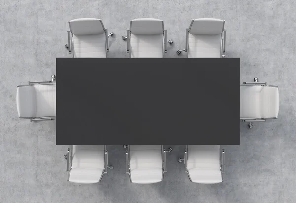 Vista superior de una sala de conferencias. Una mesa rectangular negra y ocho sillas alrededor. Interior 3D . — Foto de Stock