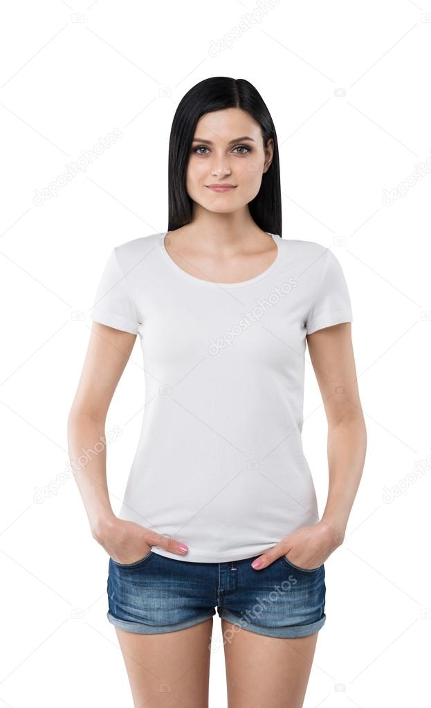 Brunette girl in a white t-shirt and denim shorts. Isolated on white.