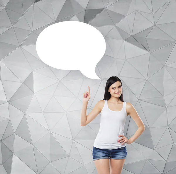 Brunette lady is pointing out the empty thought bubble. Contemporary background. — Stok fotoğraf