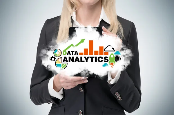 Blonde business woman holds a tablet with cloud and analytical chart. — Stockfoto
