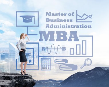 Businessman standing on a rock and looking at the future perspectives of MBA degree. Mountain landscape.