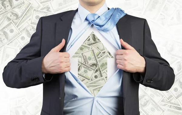 Businessman is tearing the shirt on the chest. Dollar notes under the shirt. The concept of the business soul. Dollar notes background. — Stockfoto