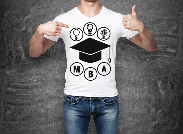 Close-up of a man pointing his finger to the chest with the sketch of the graduation hat. A concept of the MBA degree. shooting mark. Black chalk board on background. — Stok fotoğraf