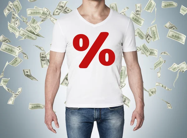 Close up of the body view of the man in a white t-shirt with the red percentage sign on the chest. Concept of the sale. Falling dollar notes over blue background. — Stockfoto