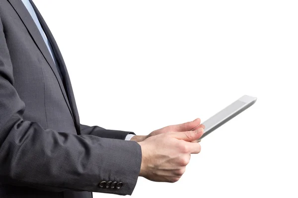 Close-up of side view of a businessman who is browsing on his tablet. Isolated. — Stock Photo, Image