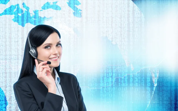 Brunette support operator in headset and digital world with binary code on the background. Elements of this image furnished by NASA. — Stock Photo, Image