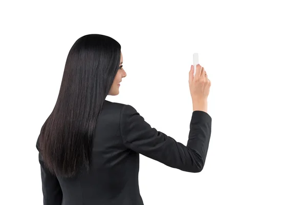 Vista trasera de una mujer morena que está escribiendo algo en el espacio de copia. Aislado sobre fondo blanco . —  Fotos de Stock