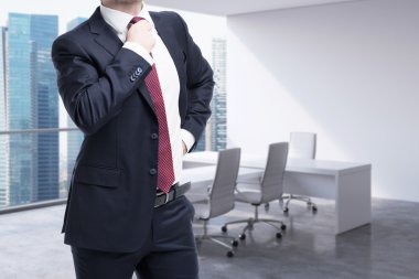 A close up of the person in the office. CEO at the working place in modern panoramic Singapore office. Consulting services concept.