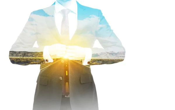A transparent silhouette of a businessman. A road landscape on the background. — Stockfoto