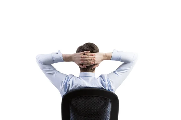 Rear view of the relaxing businessman in the office chair. Isolated. — Stock fotografie