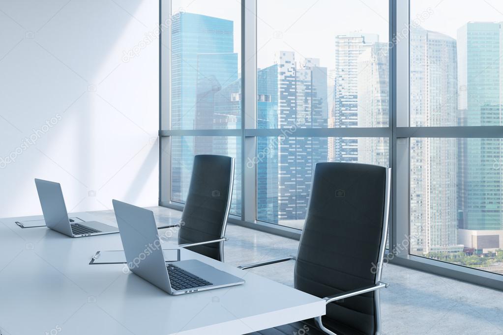 Modern meeting room with huge windows looking at Singapore business city. Black leather chairs and a white table with laptops. 3D rendering.