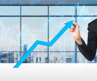 A hand is drawing a growing blue arrow. Forex chart and New York cityscape on the background.
